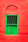 India, West Bengal, Kolkata, College Square. Bright green window in bright red wall. Art Print